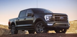A black 2021 Ford F-150 parked on a worksite near San Antonio, TX