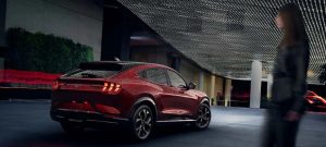 A rear view of a red 2021 Ford Mustang Mach-E