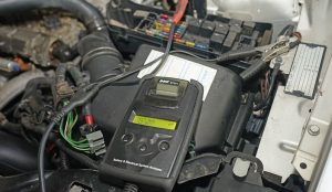 Testing a car battery at Jordan Ford's service center in San Antonio, TX