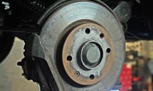 A brake disc on a car being repaired at Jordan Ford Service Center in San Antonio, TX